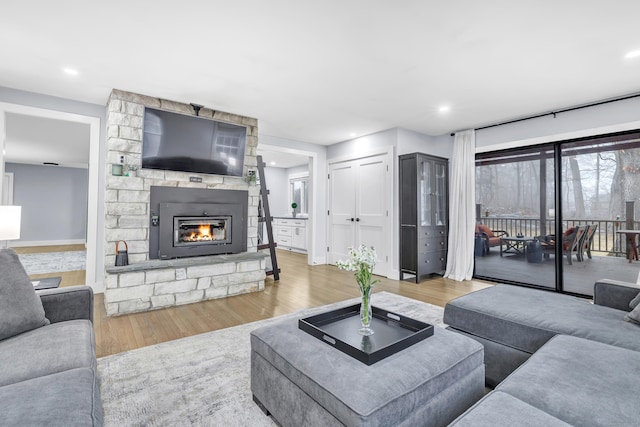 living room featuring hardwood / wood-style floors and a fireplace