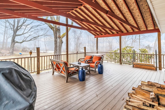 wooden deck featuring grilling area and outdoor lounge area