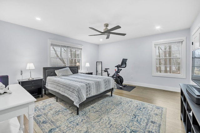 bedroom featuring ceiling fan and light hardwood / wood-style floors