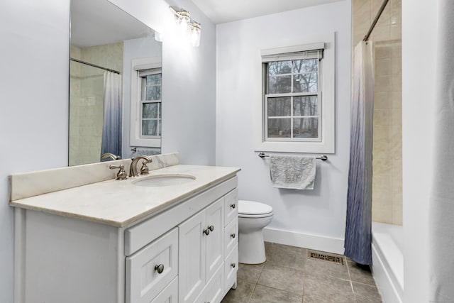 bathroom with vanity, tile patterned flooring, and toilet