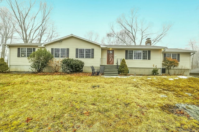 single story home featuring a front yard