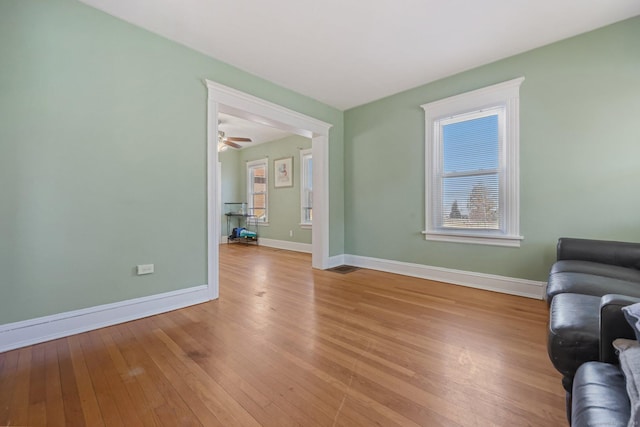 living room featuring plenty of natural light and light hardwood / wood-style flooring