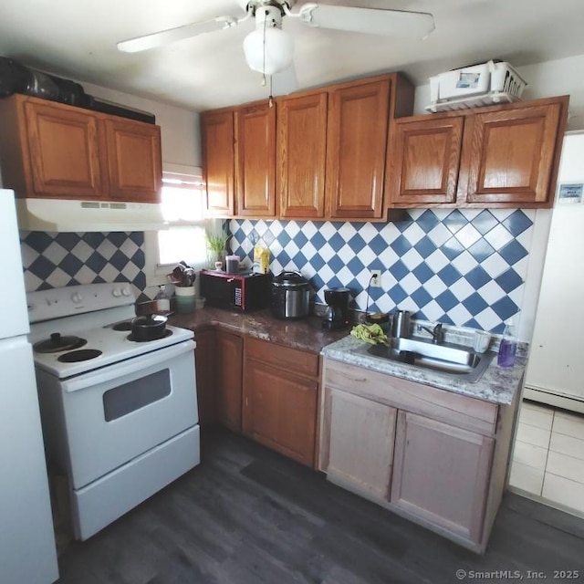 kitchen with white appliances, sink, backsplash, dark hardwood / wood-style floors, and ceiling fan