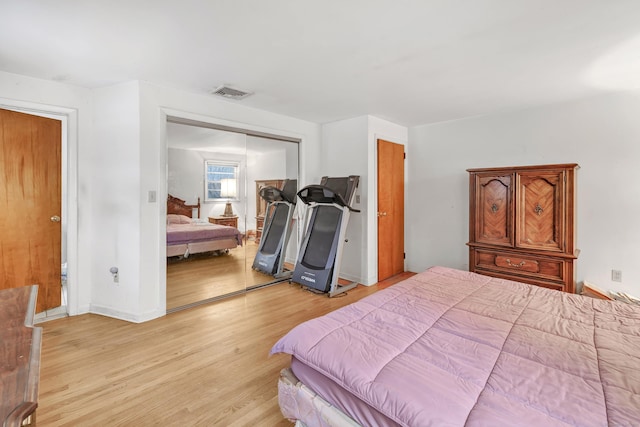 bedroom featuring a closet and light wood-type flooring