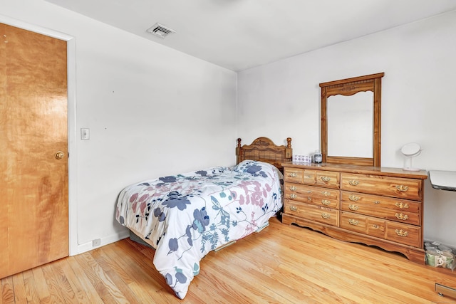 bedroom featuring hardwood / wood-style floors