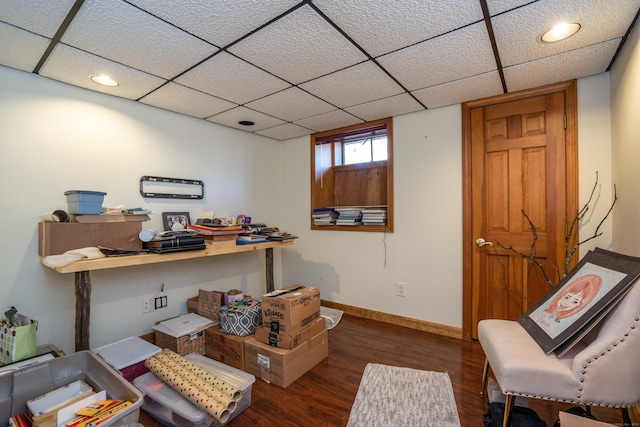 home office with dark hardwood / wood-style floors