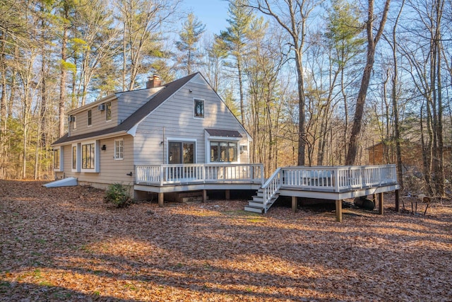 back of property featuring a deck