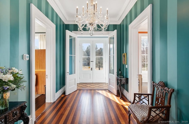 114 Walkley Hill Rd, Haddam, CT 06438 - foyer entrance with hardwood / wood-style floors, ornamental molding, french doors, a chandelier, and wallpapered walls