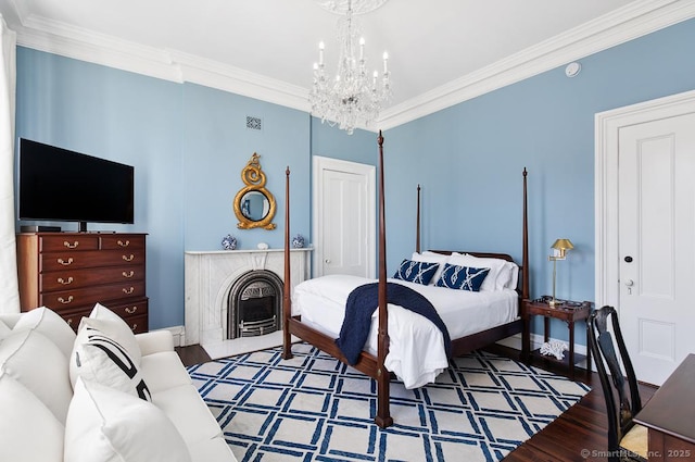 114 Walkley Hill Rd, Haddam, CT 06438 - bedroom with crown molding, a chandelier, wood finished floors, and a closet