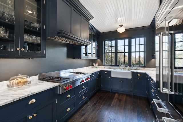 114 Walkley Hill Rd, Haddam, CT 06438 - kitchen featuring stainless steel gas cooktop, glass insert cabinets, blue cabinets, light stone counters, and ornamental molding
