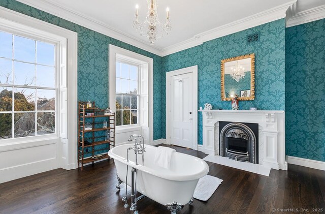 114 Walkley Hill Rd, Haddam, CT 06438 - bathroom with a chandelier, wood finished floors, a freestanding tub, a fireplace with flush hearth, and wallpapered walls
