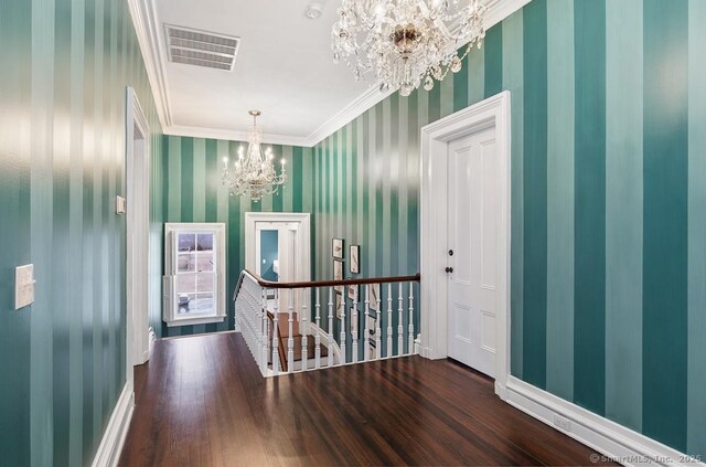 114 Walkley Hill Rd, Haddam, CT 06438 - entrance foyer featuring a chandelier, wallpapered walls, wood finished floors, and crown molding