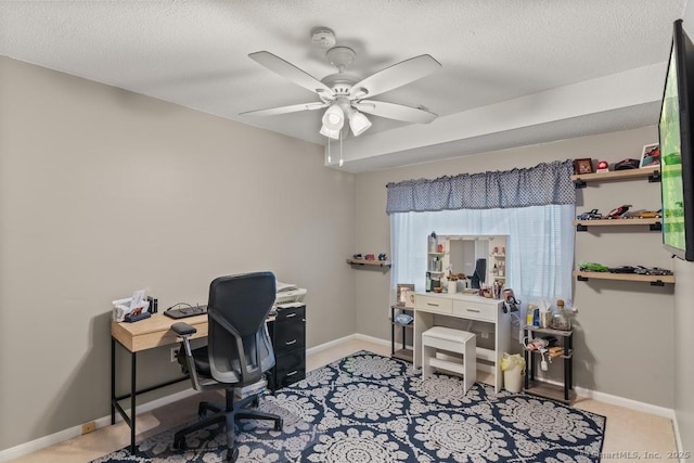 office with ceiling fan, light colored carpet, and a textured ceiling