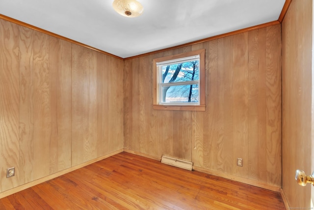 493 Babbs Rd, Suffield, CT 06093 - spare room featuring a baseboard heating unit and wood finished floors