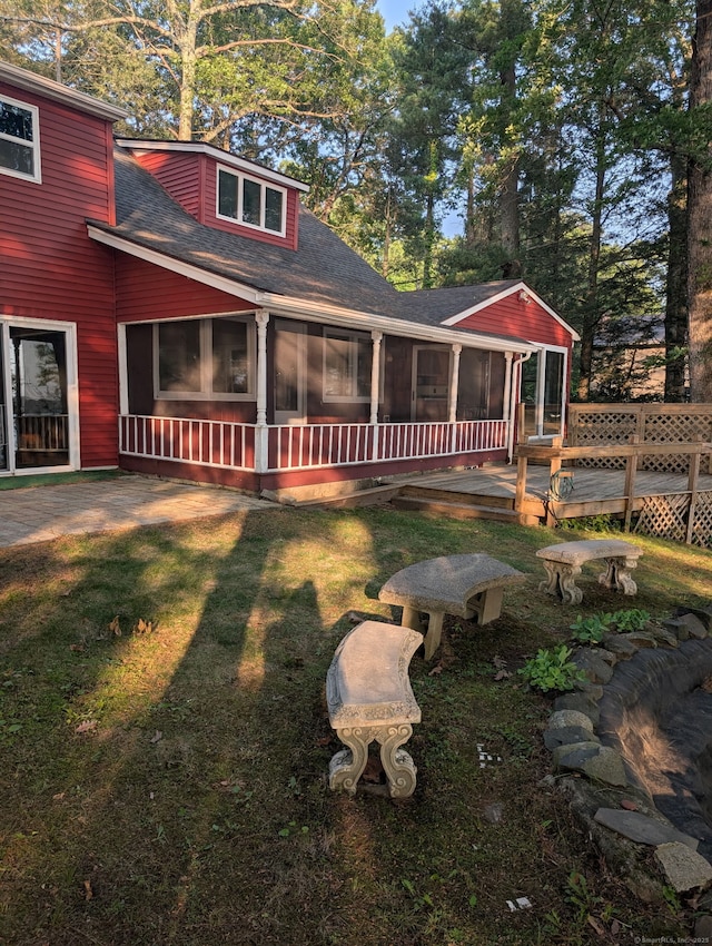 493 Babbs Rd, Suffield, CT 06093 - rear view of property with a sunroom, a shingled roof, a yard, and a wooden deck