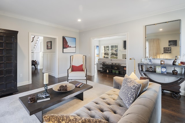 living room featuring crown molding and dark hardwood / wood-style floors