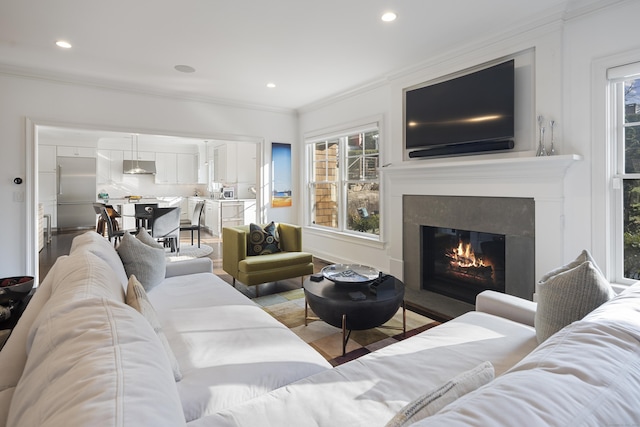 living room with ornamental molding