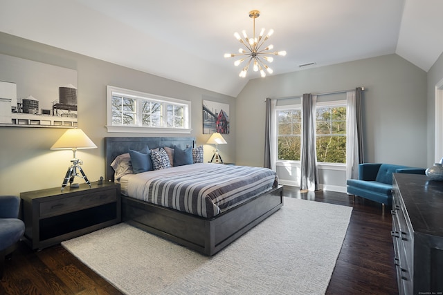 bedroom featuring a notable chandelier, vaulted ceiling, and dark hardwood / wood-style floors