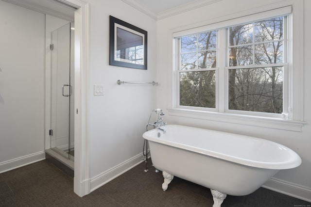 bathroom with ornamental molding and independent shower and bath