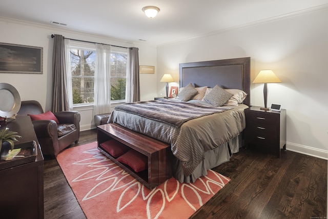 bedroom featuring crown molding and dark hardwood / wood-style floors