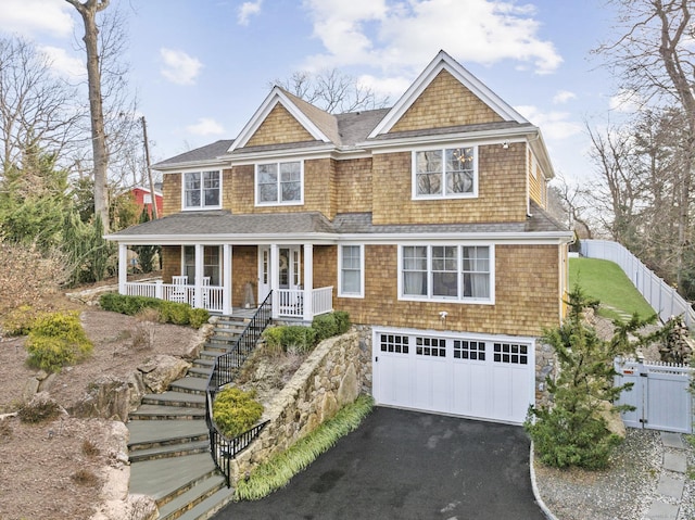 view of front of house featuring a garage and covered porch