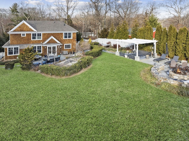 view of yard with a fire pit, a pergola, and a patio