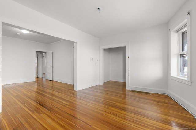 empty room with wood-type flooring