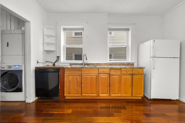 kitchen featuring sink, crown molding, black dishwasher, stacked washer / dryer, and white refrigerator