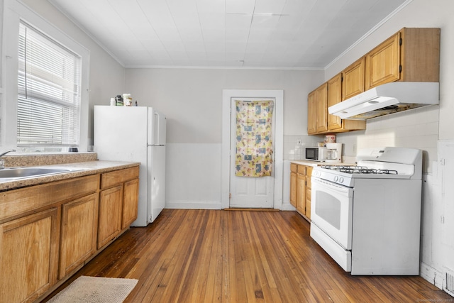 kitchen with sink, crown molding, white appliances, backsplash, and dark hardwood / wood-style floors