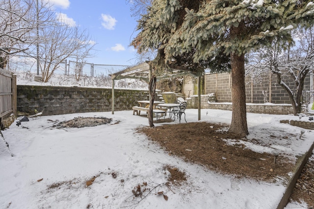 view of yard layered in snow