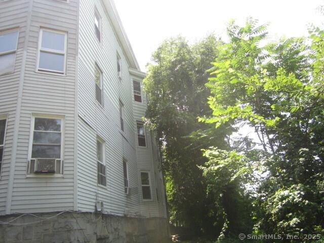 view of home's exterior with cooling unit