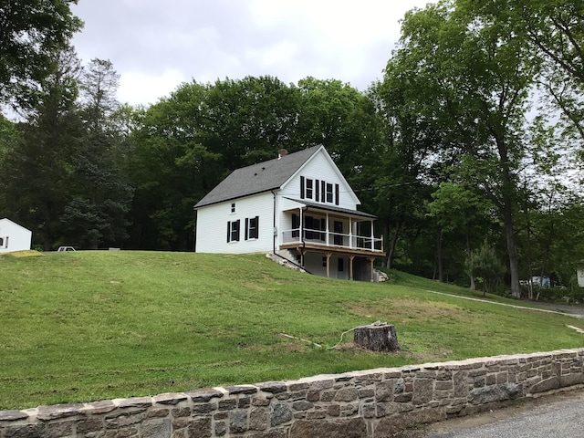 111 Pineville Rd, Killingly, CT 06241 - back of house featuring a yard, a deck, and a chimney
