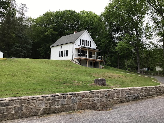 111 Pineville Rd, Killingly, CT 06241 - view of front of house with a front lawn, a deck, and a chimney