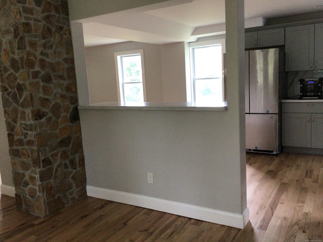 111 Pineville Rd, Killingly, CT 06241 - kitchen featuring freestanding refrigerator, baseboards, gray cabinetry, and wood finished floors