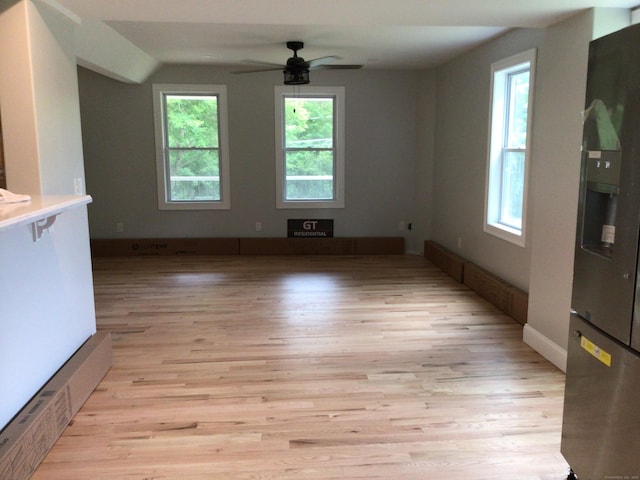111 Pineville Rd, Killingly, CT 06241 - unfurnished living room featuring light wood-style flooring, ceiling fan, and vaulted ceiling