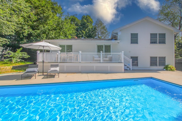 view of pool with a deck and a patio area