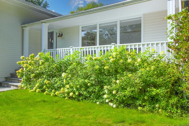 view of property exterior with a yard