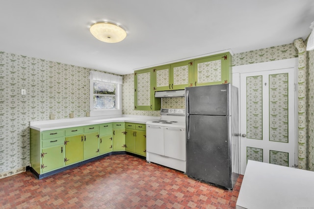 kitchen featuring white range with electric stovetop, green cabinetry, and refrigerator