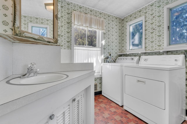 laundry area featuring separate washer and dryer and sink