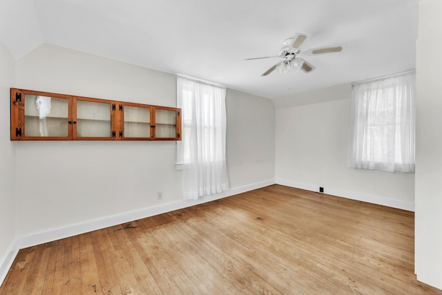 unfurnished room with ceiling fan and light wood-type flooring