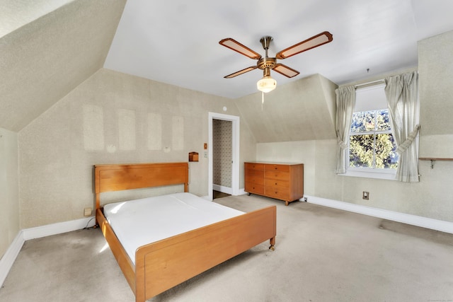 bedroom featuring ceiling fan, lofted ceiling, and light carpet