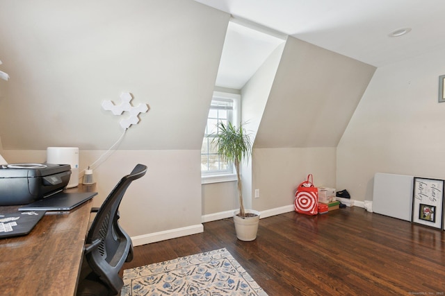 home office featuring lofted ceiling and dark hardwood / wood-style floors