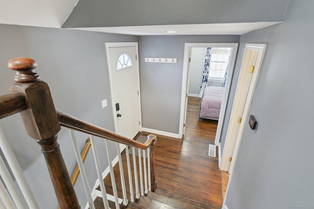 staircase with hardwood / wood-style flooring