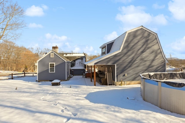 view of snow covered house