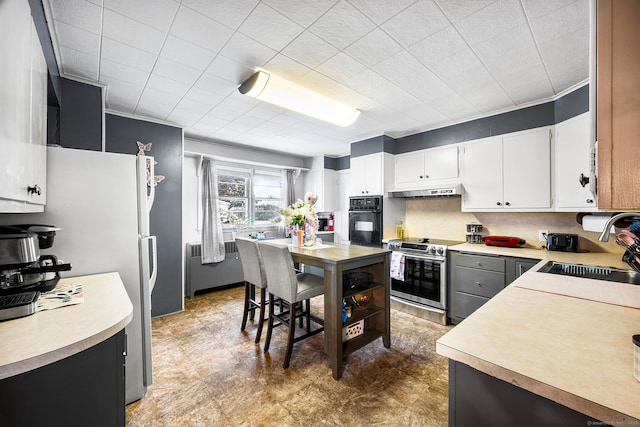 kitchen featuring white cabinetry, stainless steel electric stove, oven, refrigerator, and sink