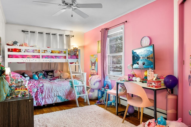 bedroom with ceiling fan, dark wood-type flooring, and crown molding