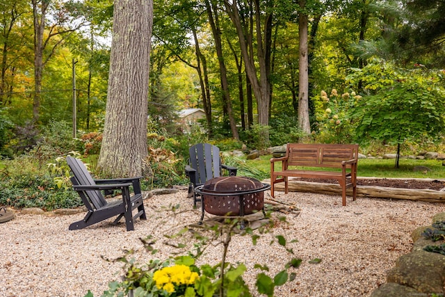 view of home's community featuring an outdoor fire pit