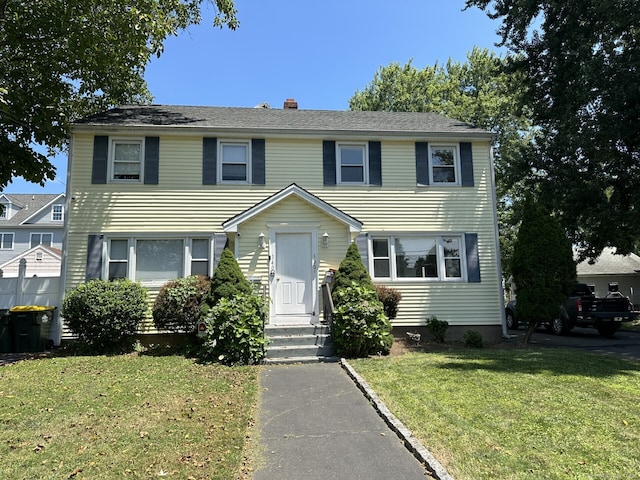 view of front of home with a front yard