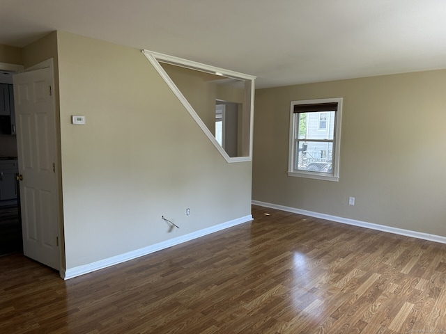 spare room featuring hardwood / wood-style flooring