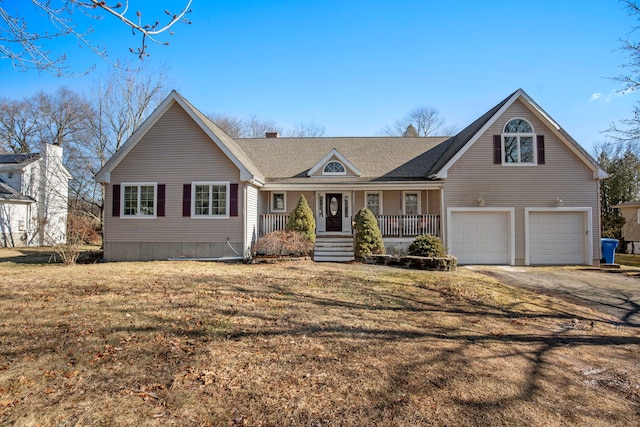 view of front facade featuring a garage, a porch, and a front yard